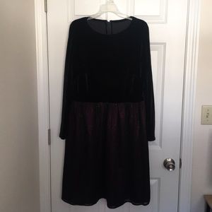 Black empire-waisted, velvet dress.